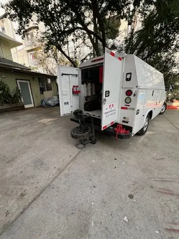 Magnet Plumbing service vehicle on-site for Grease Trap Cleaning in Holmby Hills